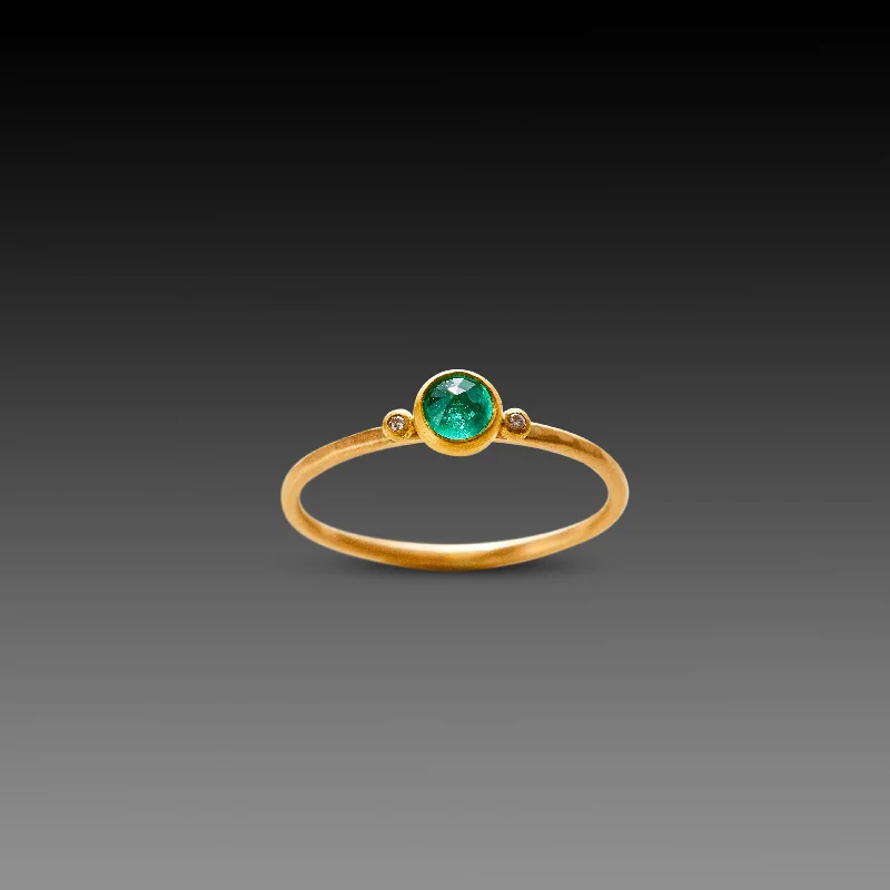 Delicate Emerald Ring with Two Diamonds